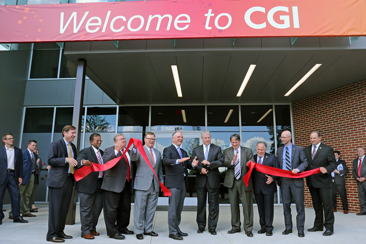 Row of Louisiana government and UL 69ý research officials cutting a ribbon at CGI's opening