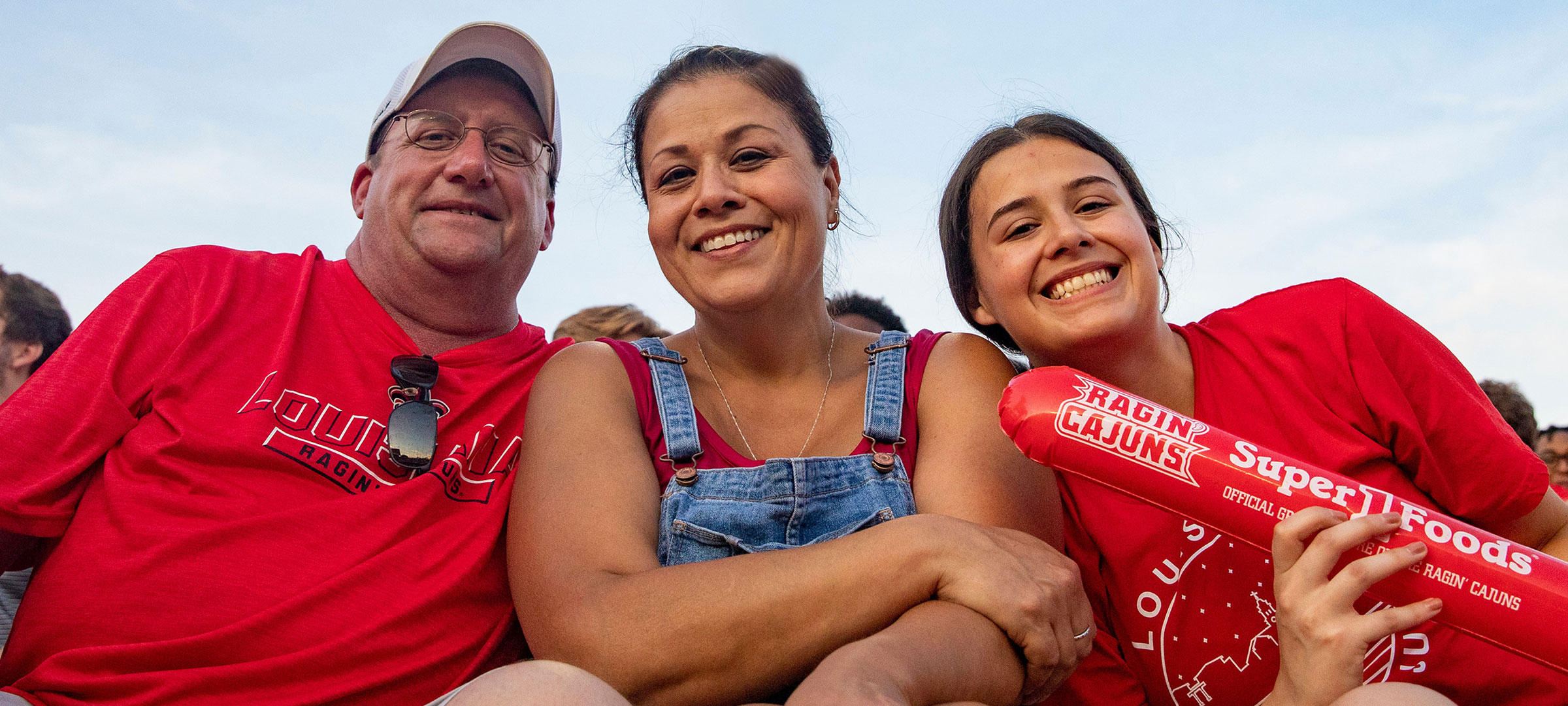 A UL 69ý student with her parents in the stands at a Louisiana Ragin' Cajuns football game
