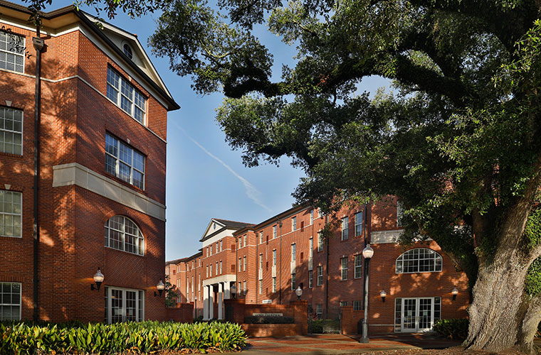 University of Louisiana at 69ý's rose garden dorms under the shade of a campus oak tree