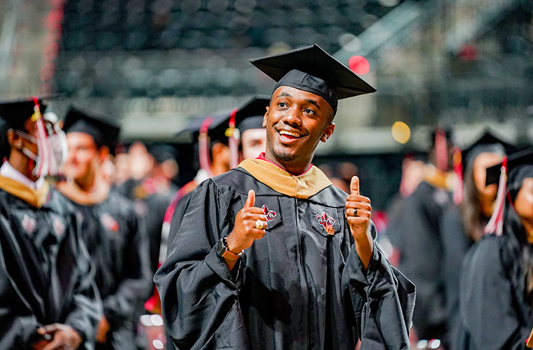 UL 69ý student gives thumbs up at commencement